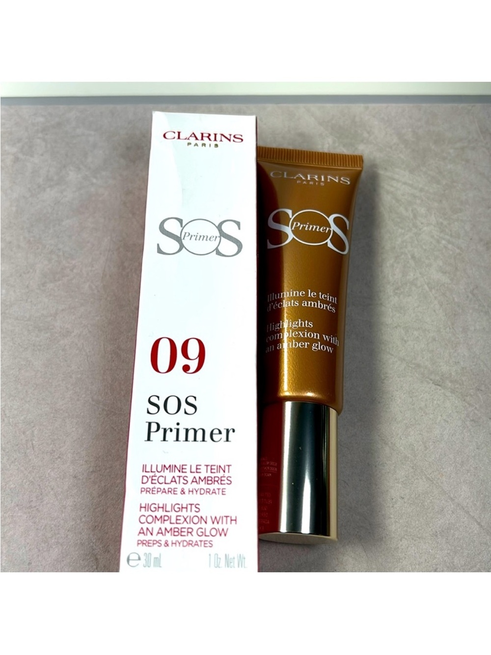 Clarins SOS Primer 09 Amber Glow - Gold Tone Illuminating Face Primer